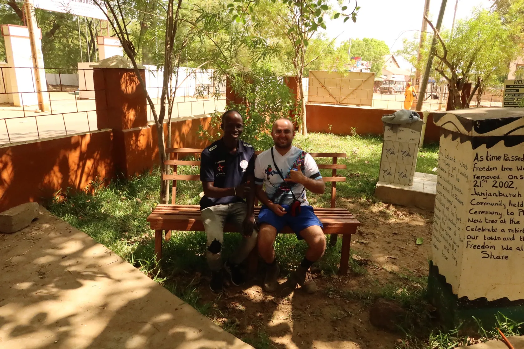 Matteo sitting next to a Gambian acquaintance